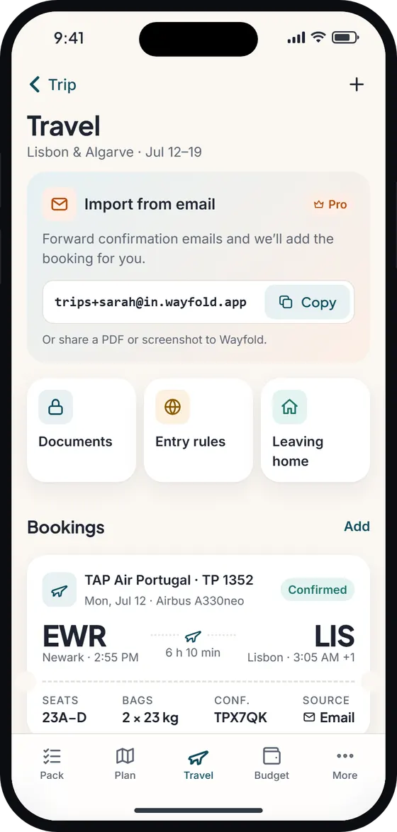 Travel tab with an import-from-email card, shortcuts to documents, entry rules and leaving home, and a TAP Air Portugal flight from Newark to Lisbon.